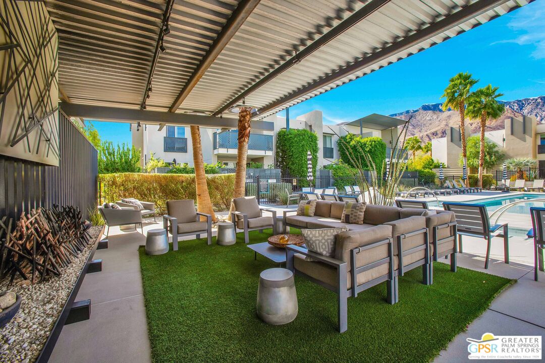 138 The River Palm Springs, CA 92262 - Photo 41 of 47 a living room with patio furniture and a garden