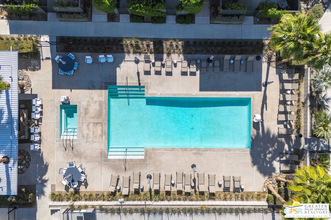 138 The River Palm Springs, CA 92262 - Photo 43 of 47 a view of building with yard and large trees