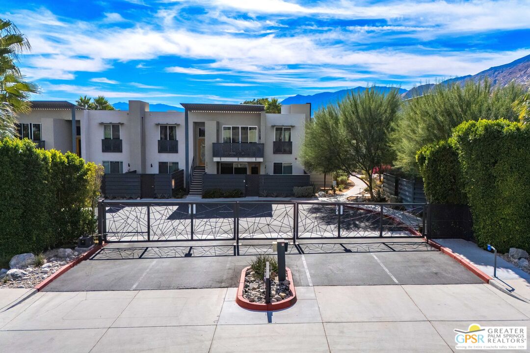 138 The River Palm Springs, CA 92262 - Photo 46 of 47 a view of a patio with dining table and chairs with a fire pit