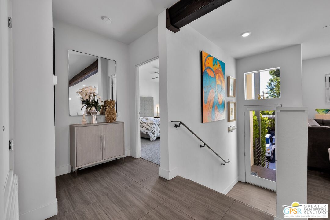 138 The River Palm Springs, CA 92262 - Photo 6 of 47 a living room with furniture and a flat screen tv