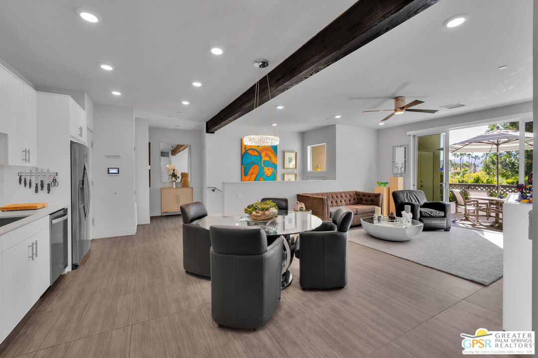 138 The River Palm Springs, CA 92262 - Photo 7 of 47 a living room with lots of furniture and painting on the wall