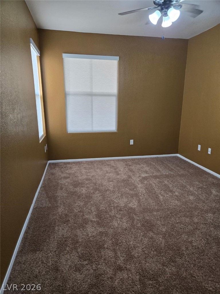 10550 West Alexander Road, Unit 1040 Las Vegas, NV 89129 - Photo 15 of 18 Warmly toned walls and soft carpeting define this inviting private bedroom space.