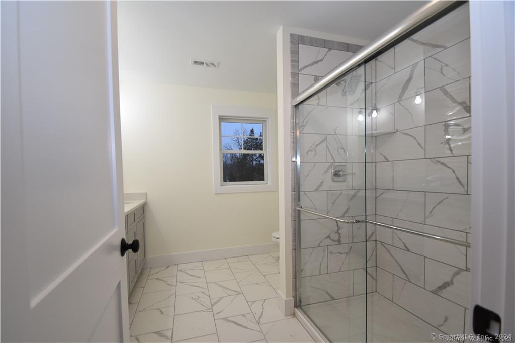 Mile Hill Road Tolland, CT 06084 - Photo 21 of 32 a bathroom with a shower