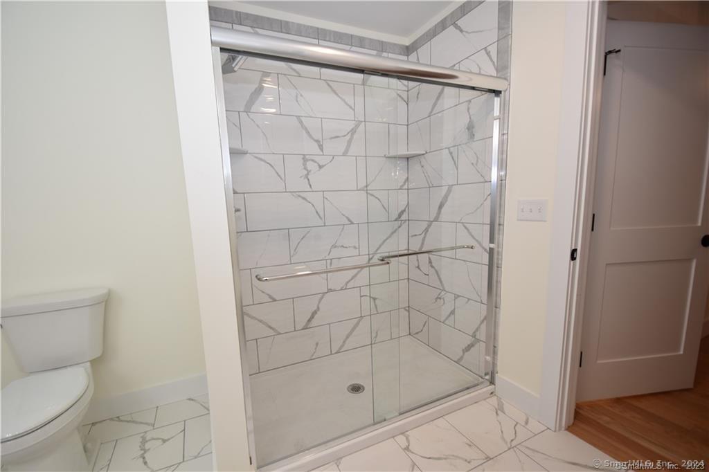 Mile Hill Road Tolland, CT 06084 - Photo 23 of 32 a bathroom with a shower and toilet