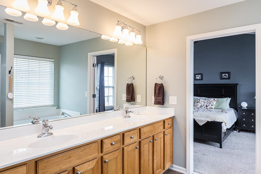 8225 Pilots View Drive Raleigh, NC 27617 - Photo 11 of 20 Gobs of cabinets and counter space and a walk in closet make sharing easy! Master Bath