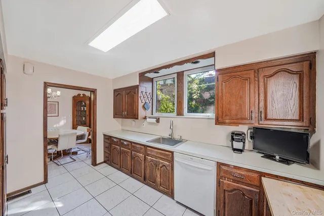 a kitchen that has a sink and a stove in it
