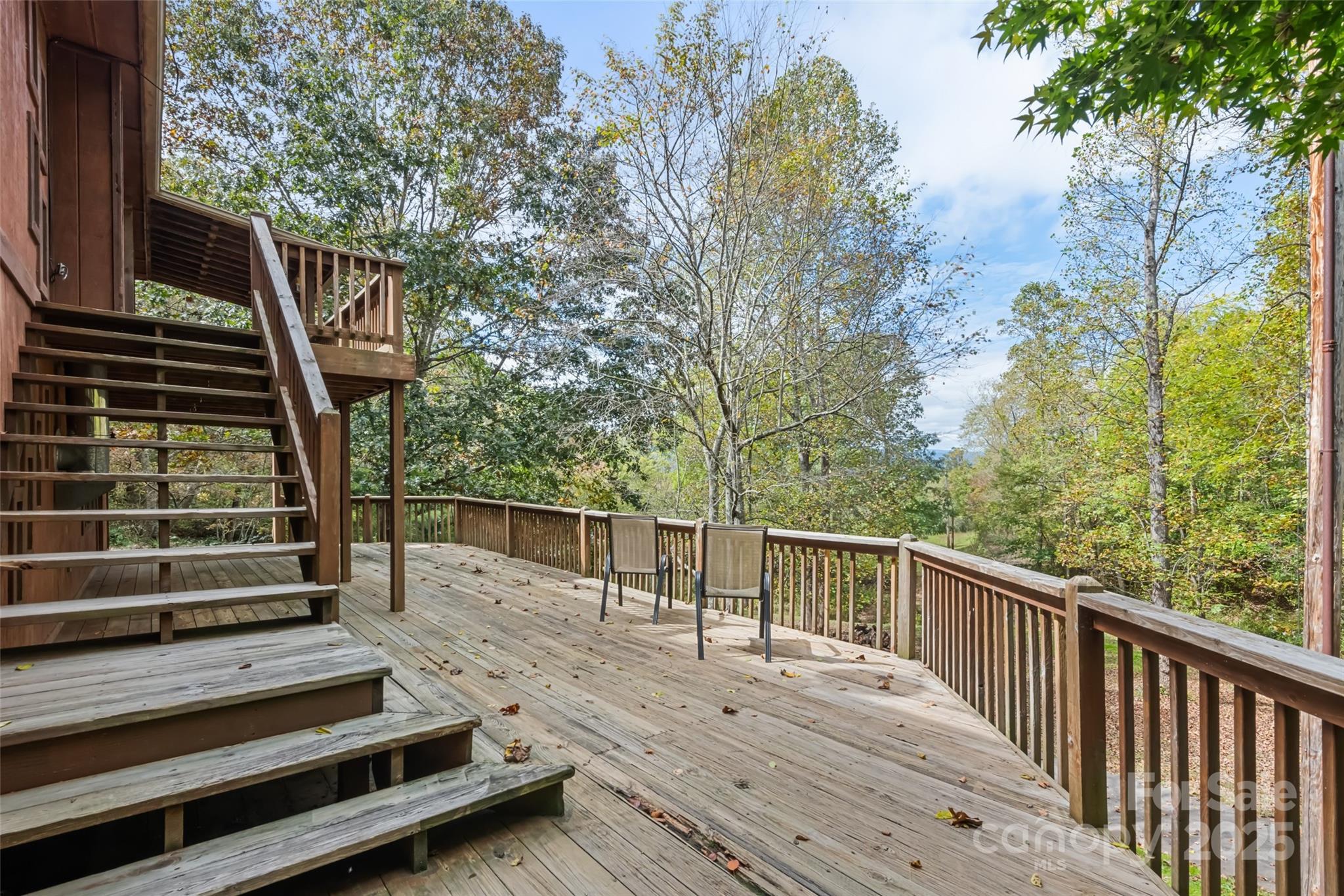 940 Haynes Cove Clyde, NC 28721 - Photo 11 of 48 a view of deck with wooden floor and fence and trees