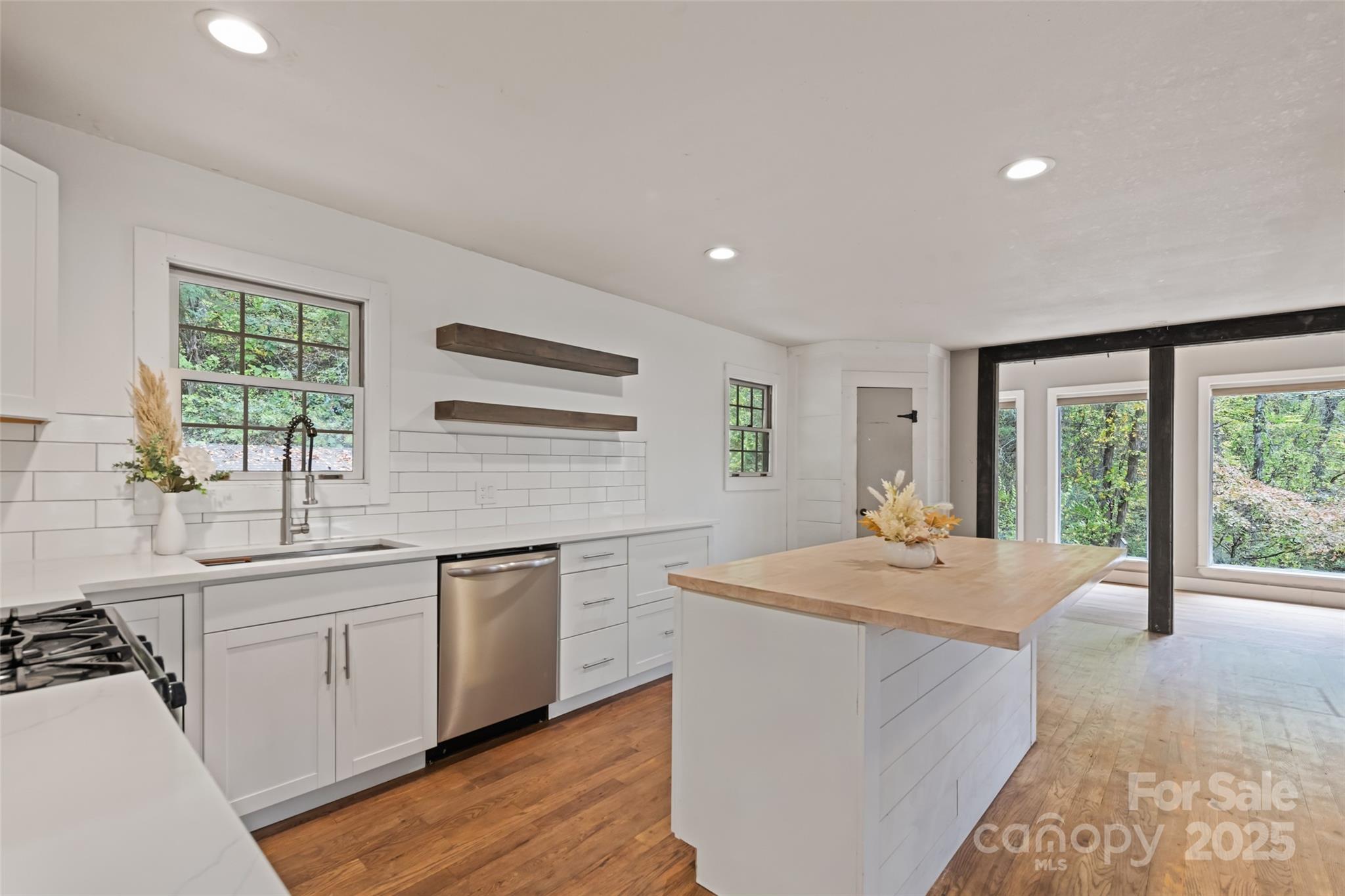 940 Haynes Cove Clyde, NC 28721 - Photo 22 of 48 a kitchen with a sink stove and cabinets