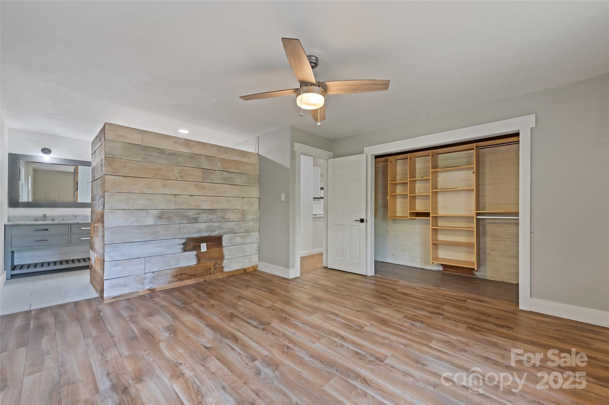 940 Haynes Cove Clyde, NC 28721 - Photo 24 of 48 an empty room with a fireplace and cabinet