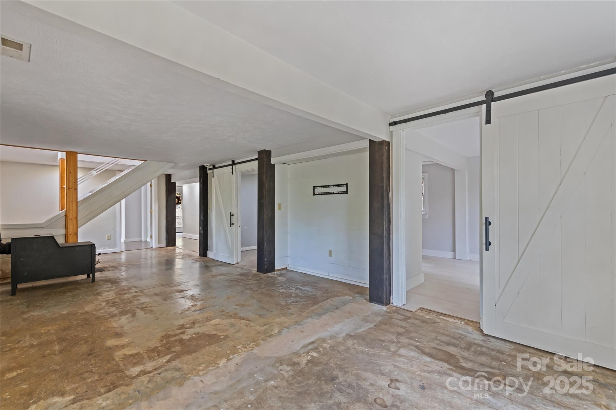 940 Haynes Cove Clyde, NC 28721 - Photo 30 of 48 a view of a big room with closet and windows