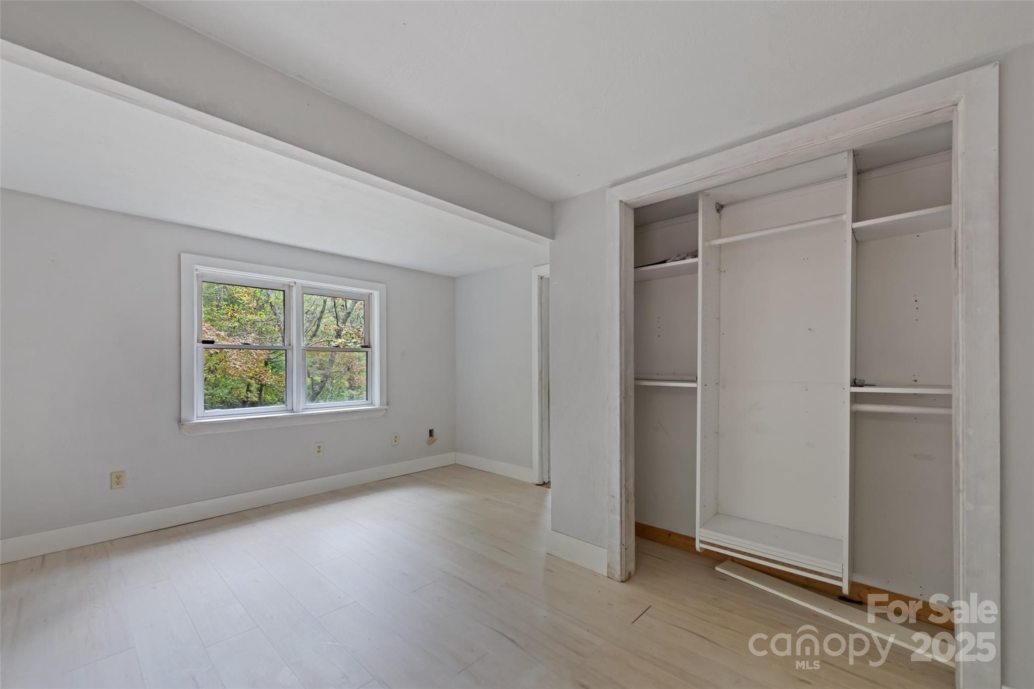 940 Haynes Cove Clyde, NC 28721 - Photo 32 of 48 a view of an empty room with window and closet area