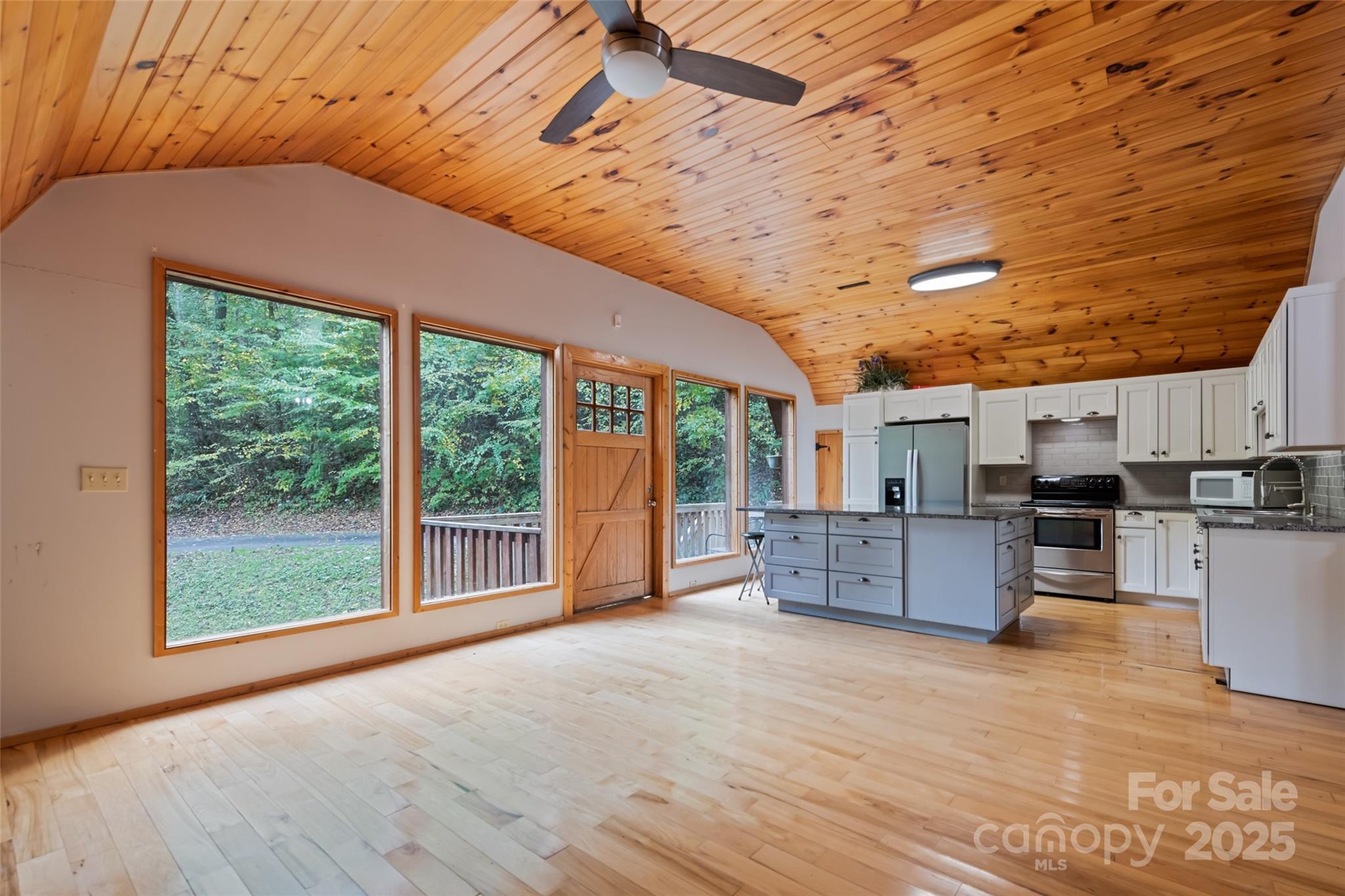 940 Haynes Cove Clyde, NC 28721 - Photo 39 of 48 a living room with furniture and kitchen view