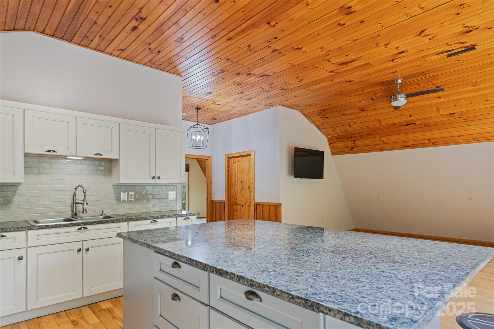 940 Haynes Cove Clyde, NC 28721 - Photo 41 of 48 a kitchen with stainless steel appliances granite countertop a sink stove and cabinets