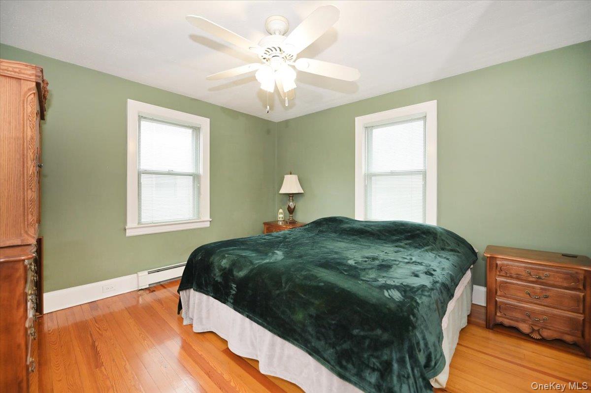 2016 Abbot Avenue Merrick, NY 11566 - Photo 17 of 26 a bedroom with a bed and a window