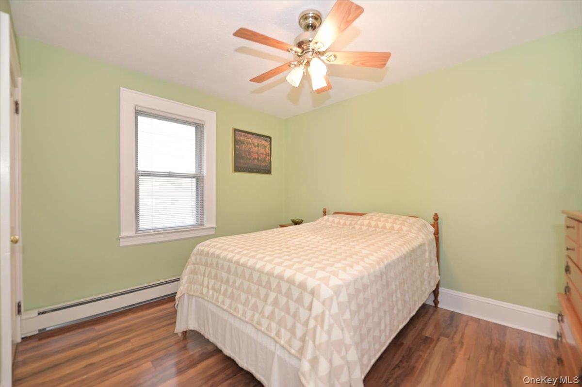 2016 Abbot Avenue Merrick, NY 11566 - Photo 18 of 26 a bedroom with a bed and a window
