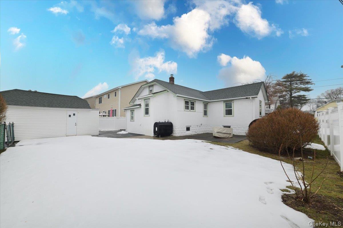 2016 Abbot Avenue Merrick, NY 11566 - Photo 25 of 26 a view of a house with a yard and garage