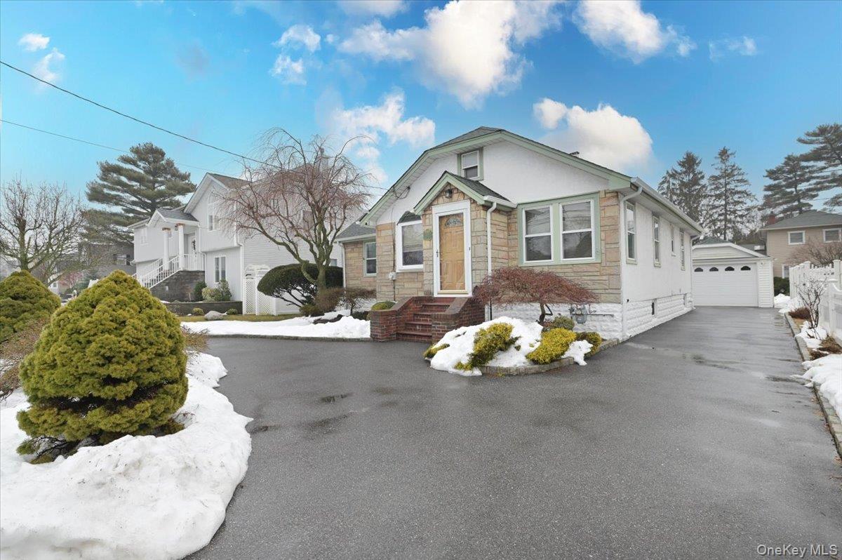 2016 Abbot Avenue Merrick, NY 11566 - Photo 5 of 26 a front view of a house with a yard