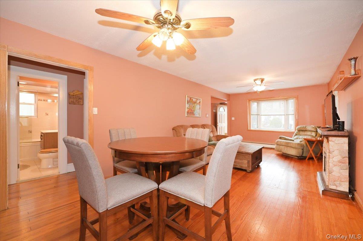 2016 Abbot Avenue Merrick, NY 11566 - Photo 9 of 26 a view of a dining room with furniture and wooden floor