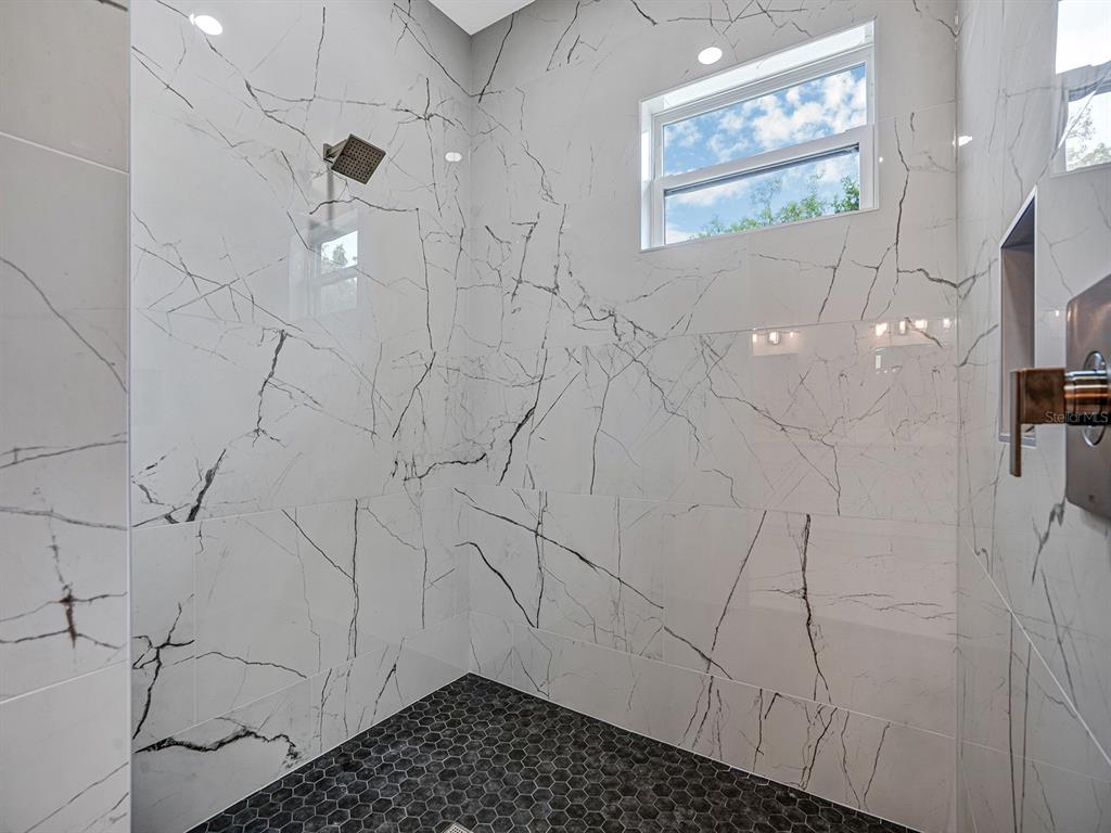 108 Irwin Street East Safety Harbor, FL 34695 - Photo 49 of 79 a bathroom with a shower