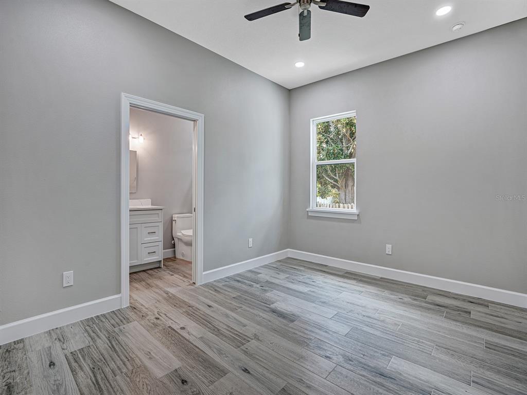 108 Irwin Street East Safety Harbor, FL 34695 - Photo 56 of 79 wooden floor in an empty room with a window