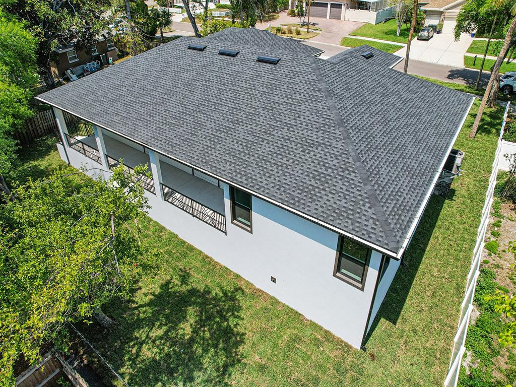 108 Irwin Street East Safety Harbor, FL 34695 - Photo 10 of 79 an aerial view of a house with backyard and trees