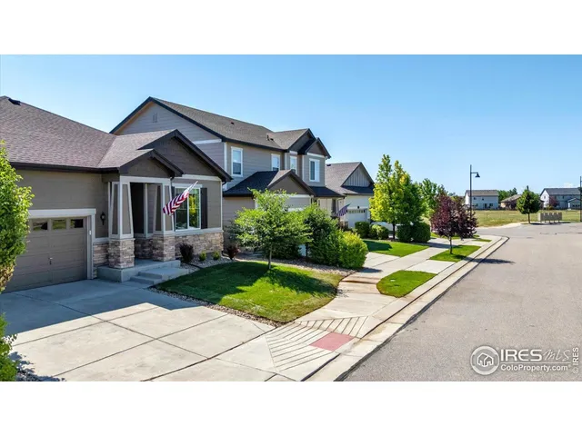 a backyard of a house with yard and outdoor seating