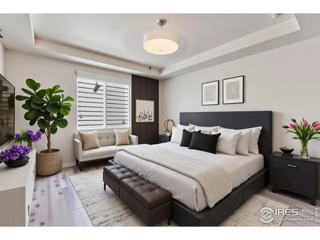 a bedroom with a bed plant and a window