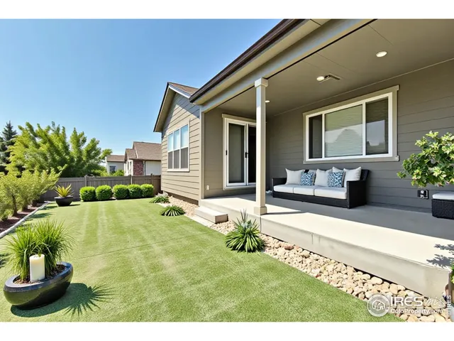 a swimming pool with outdoor seating and yard