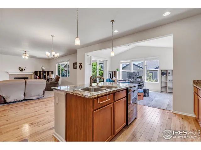 a kitchen with stainless steel appliances kitchen island a large island in the center