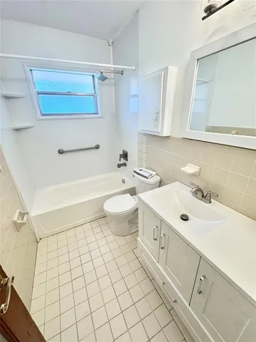 a bathroom with a sink toilet and vanity