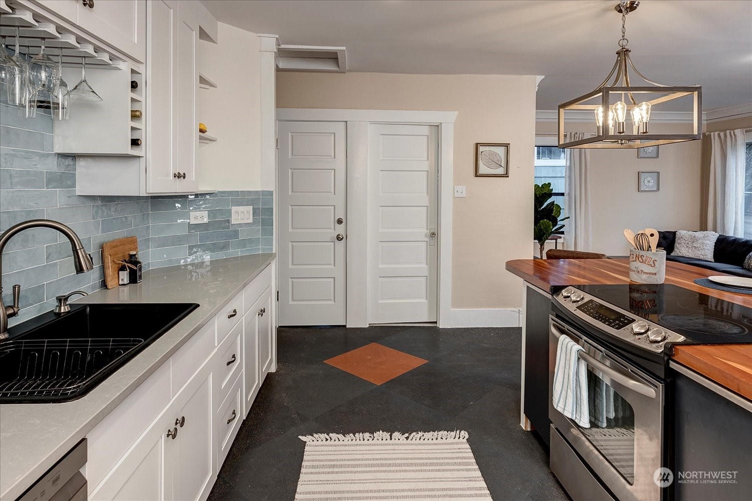 343 North 81st Street Seattle, WA 98103 - Photo 12 of 38 a kitchen with stainless steel appliances a stove a sink and a refrigerator