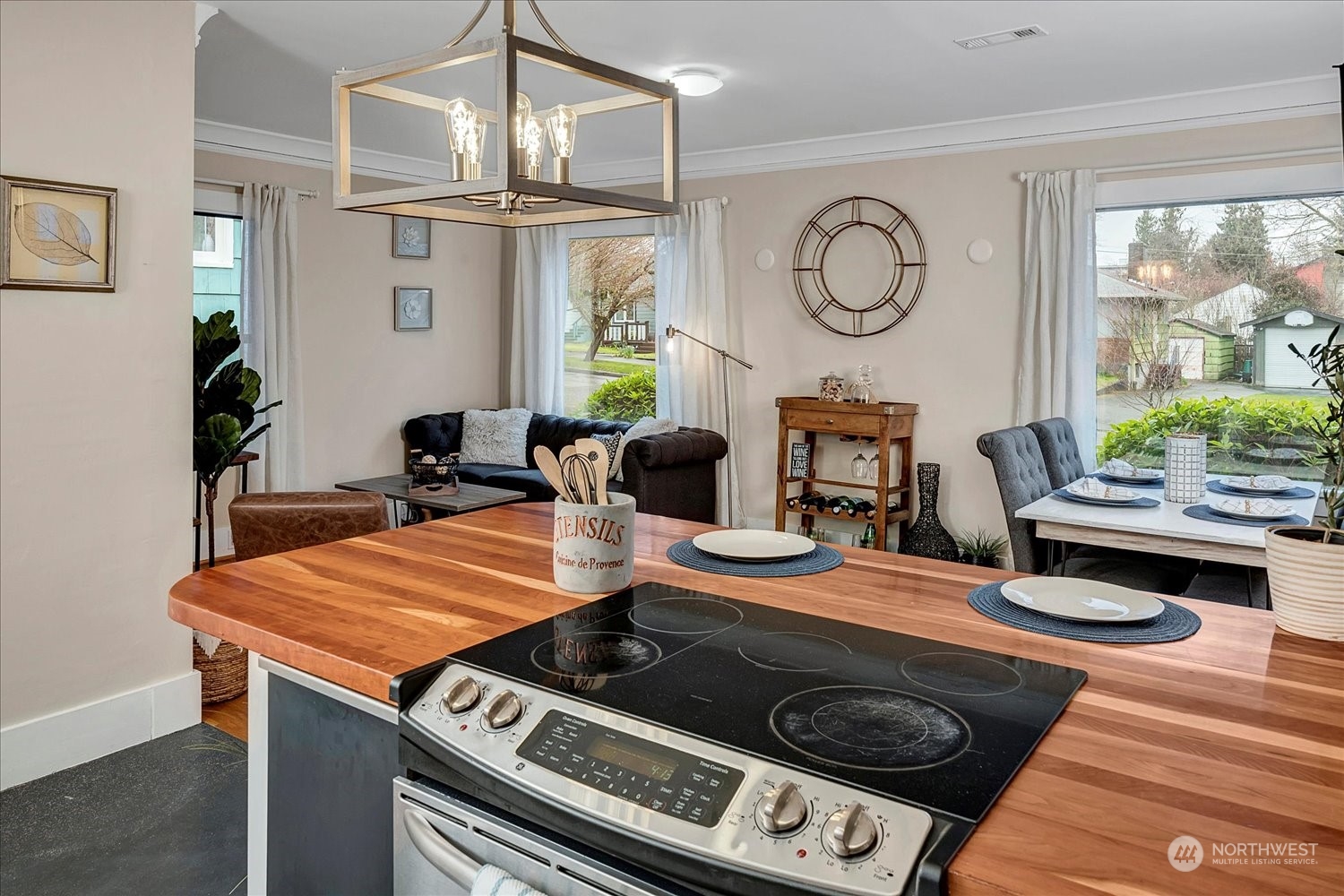 343 North 81st Street Seattle, WA 98103 - Photo 13 of 38 a table and chairs in a kitchen
