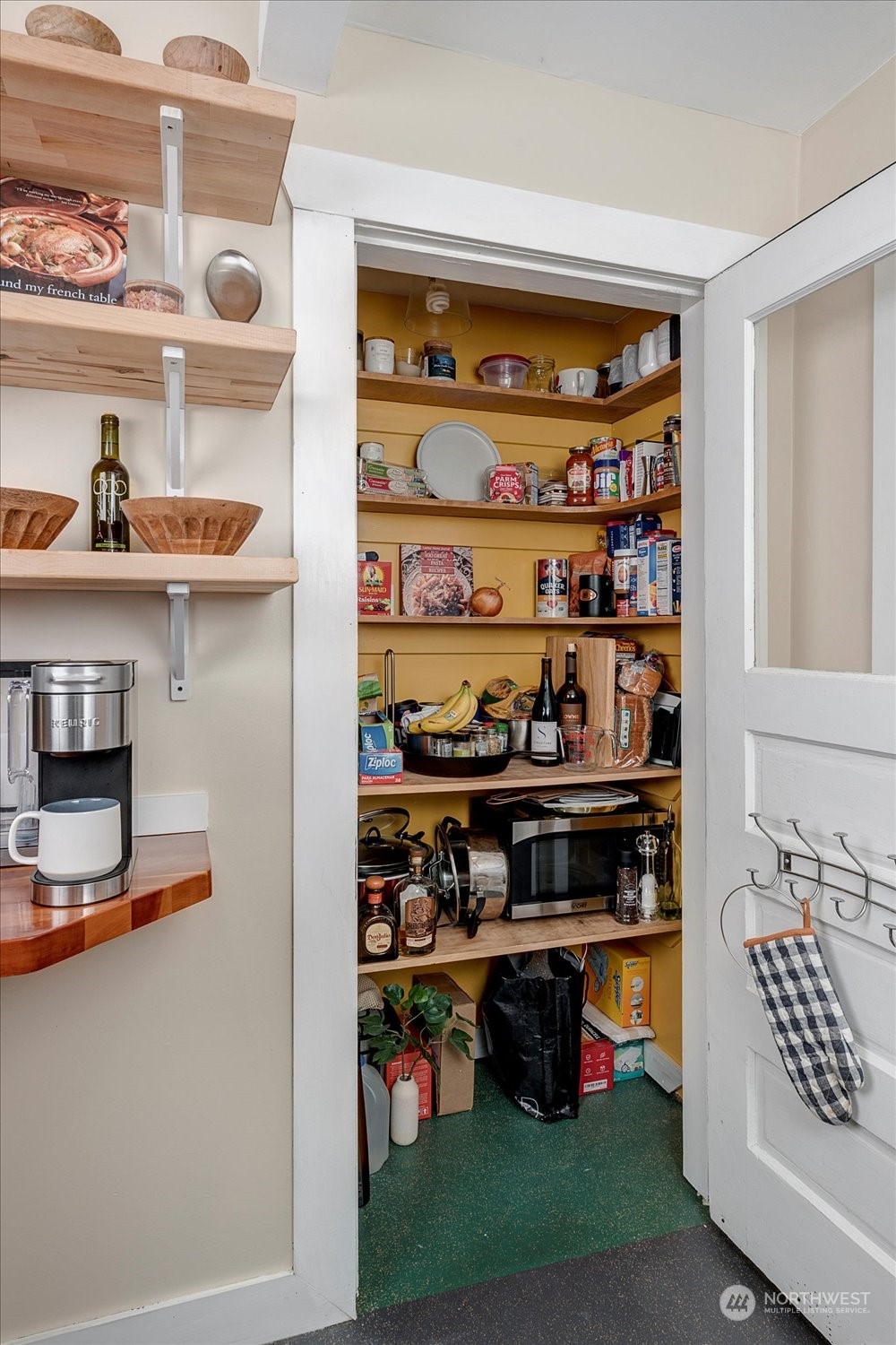343 North 81st Street Seattle, WA 98103 - Photo 15 of 38 a kitchen with a stove and cabinets