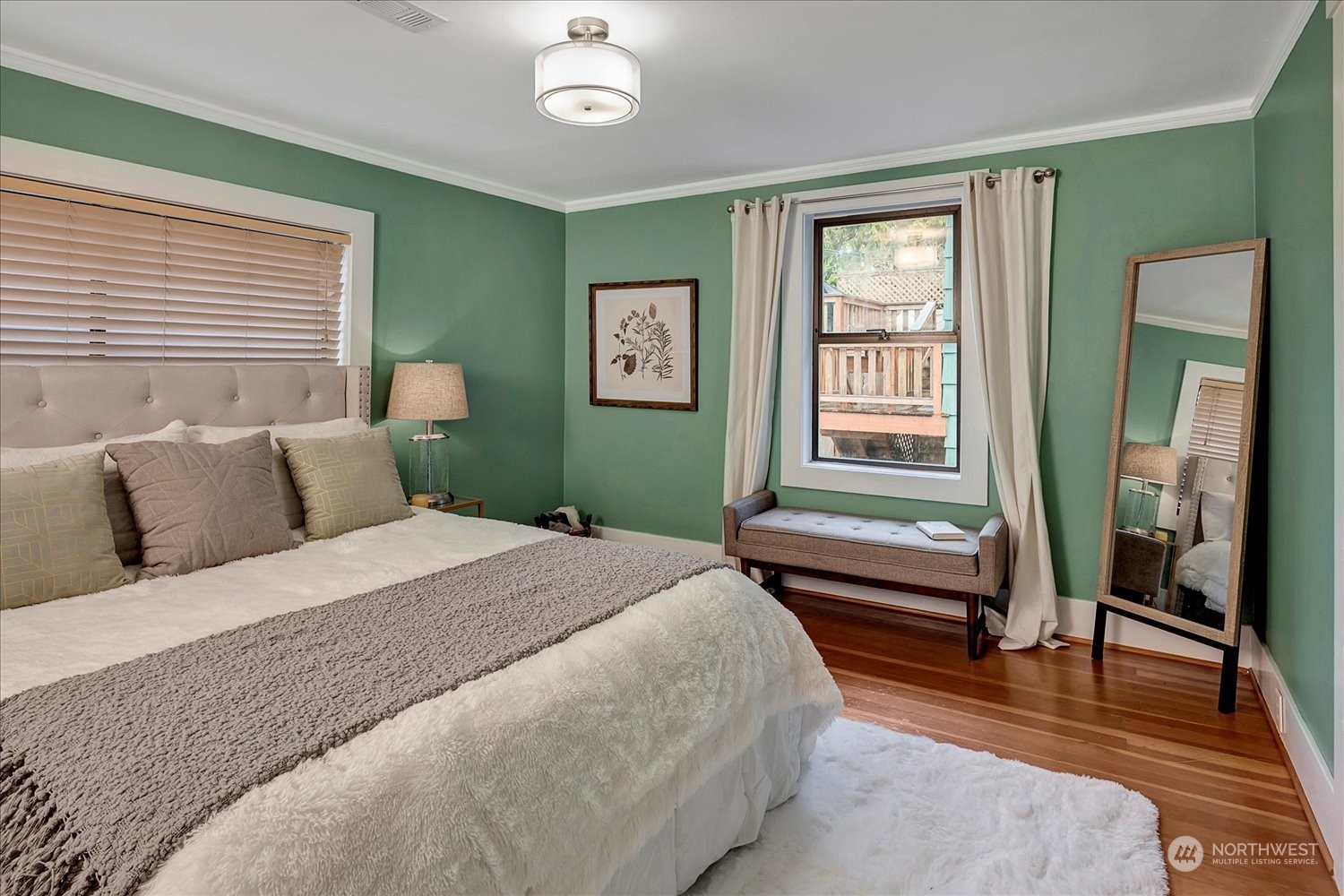 343 North 81st Street Seattle, WA 98103 - Photo 17 of 38 a bedroom with a large bed and a window