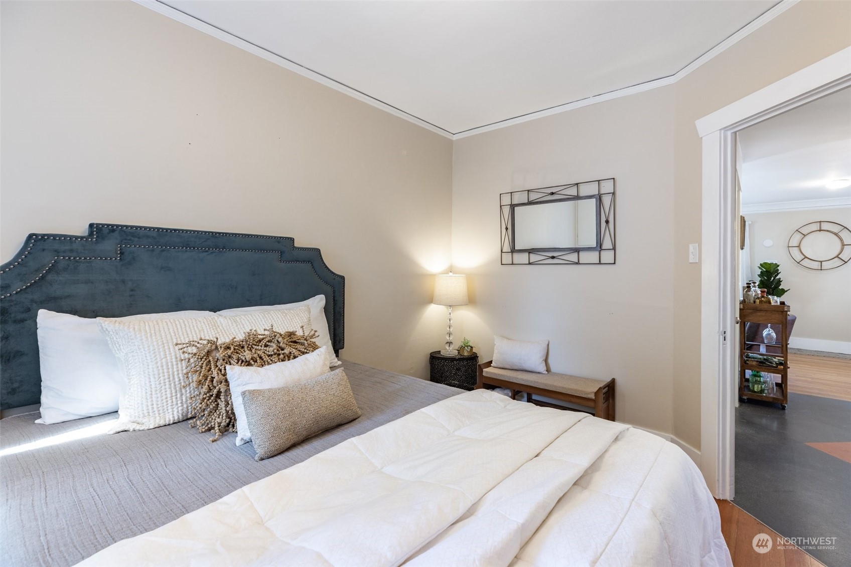 343 North 81st Street Seattle, WA 98103 - Photo 19 of 38 a bedroom with a bed and wooden floor