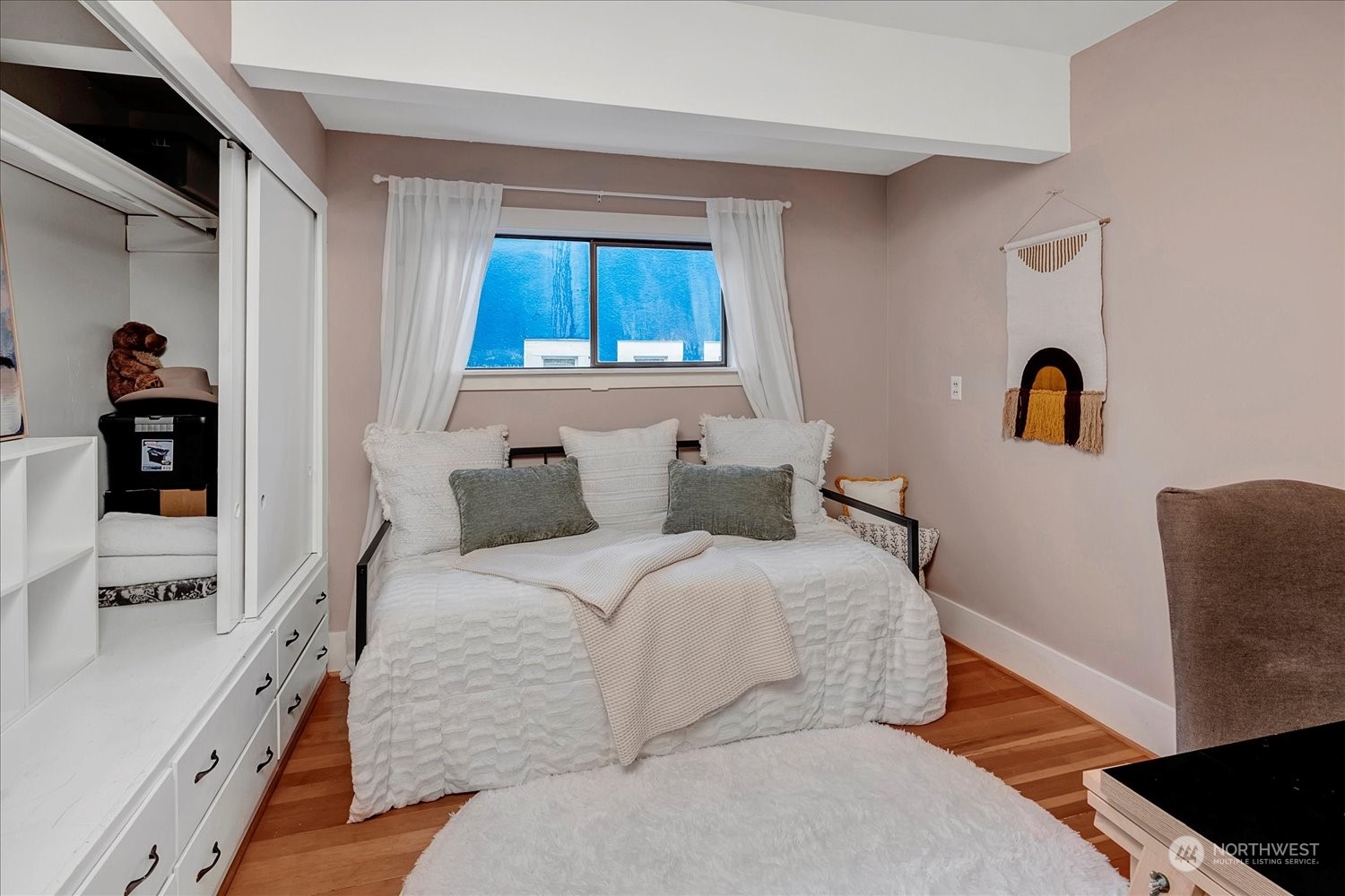 343 North 81st Street Seattle, WA 98103 - Photo 21 of 38 a bedroom with bed and a window