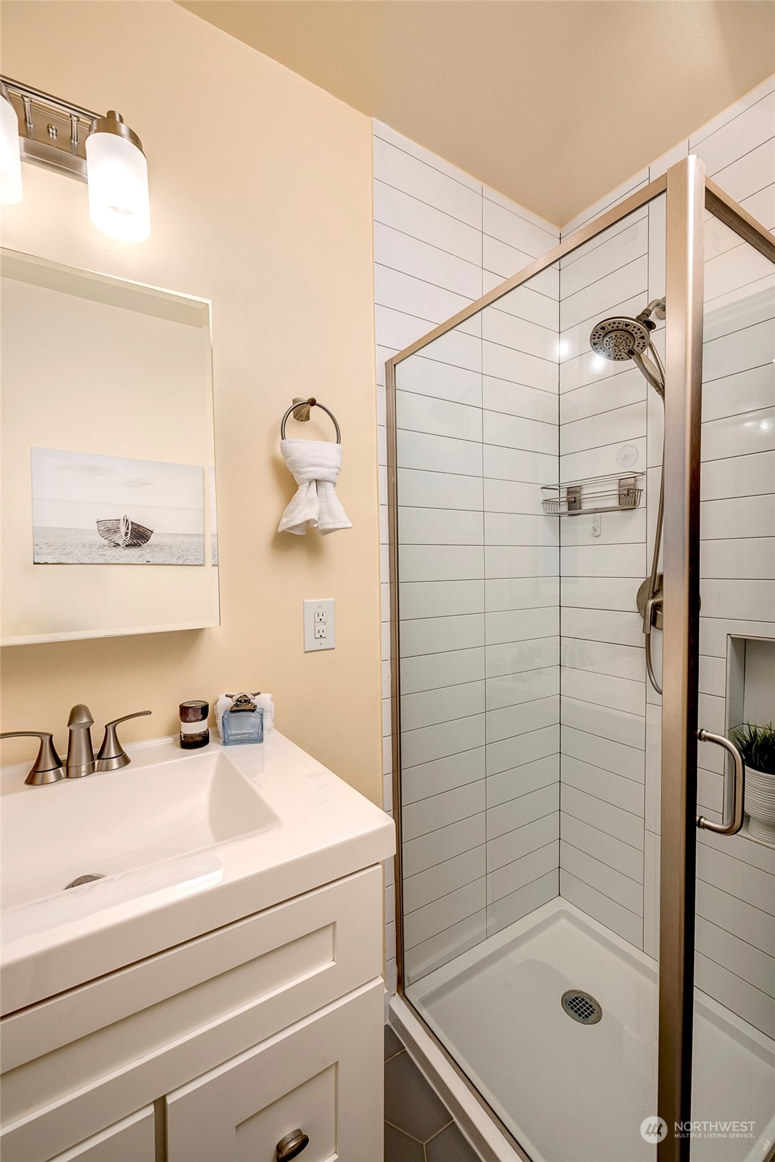 343 North 81st Street Seattle, WA 98103 - Photo 24 of 38 a bathroom with a shower and mirror