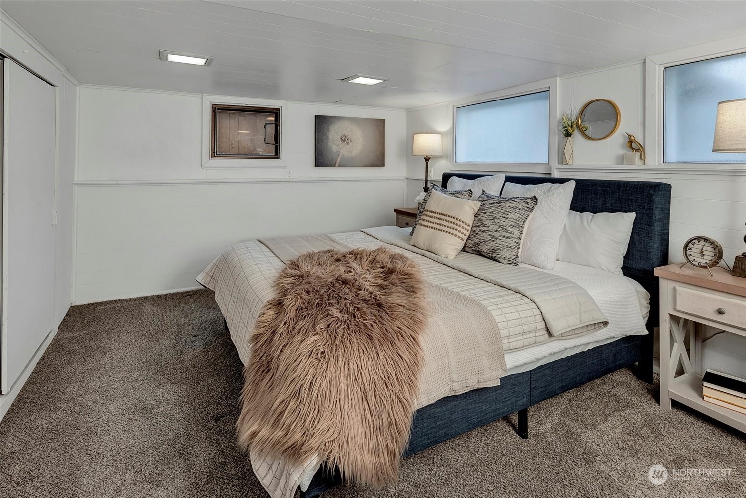 343 North 81st Street Seattle, WA 98103 - Photo 31 of 38 a bed room with a bed and painting on the wall