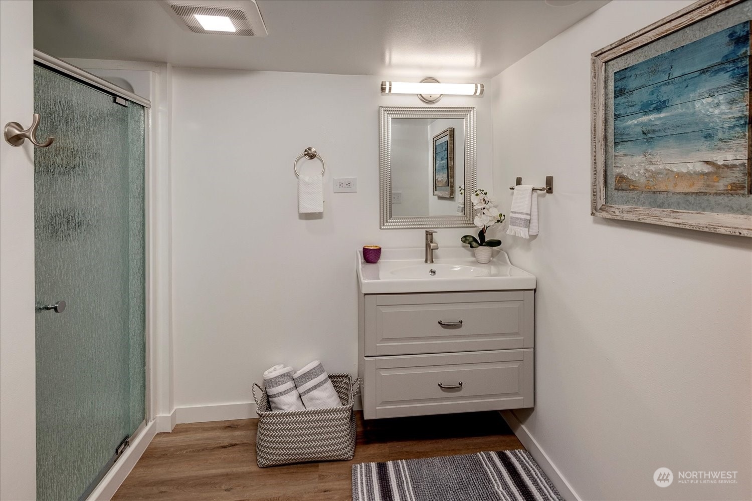 343 North 81st Street Seattle, WA 98103 - Photo 33 of 38 a bathroom with a sink and a mirror