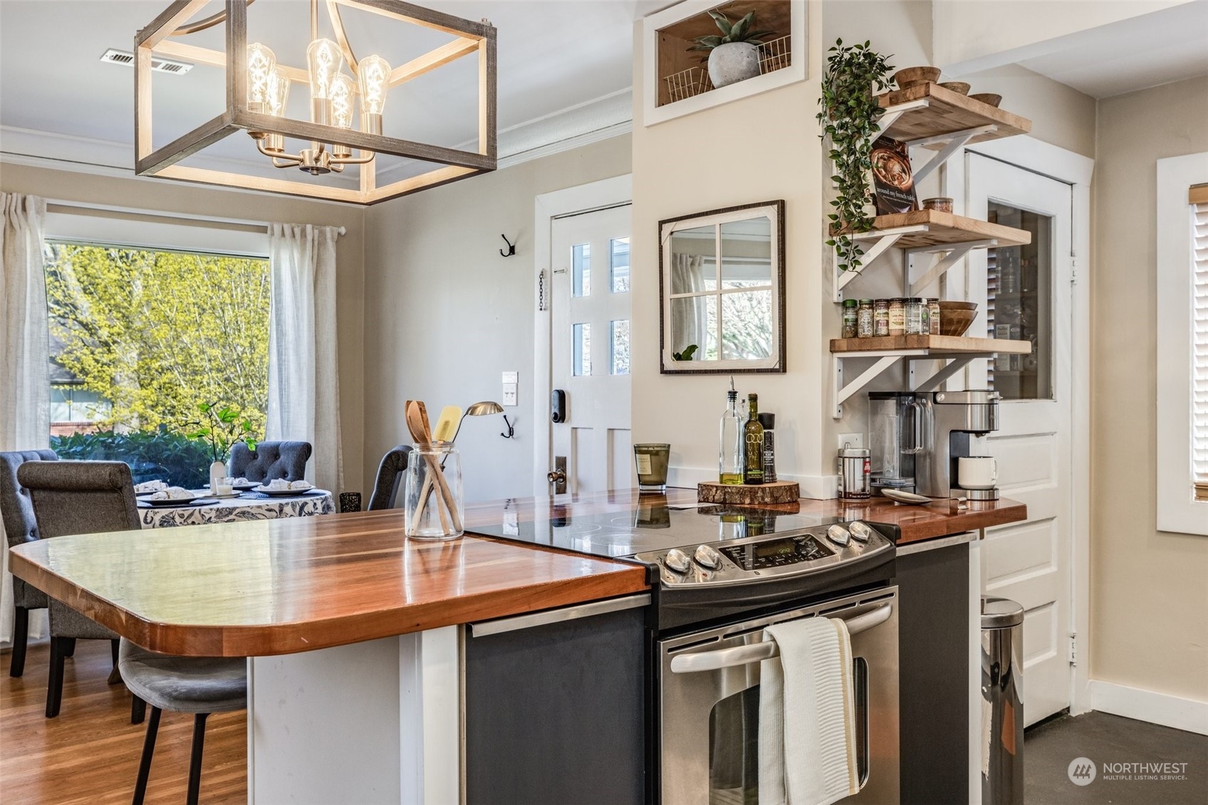 343 North 81st Street Seattle, WA 98103 - Photo 5 of 38 a kitchen with a sink cabinets and window