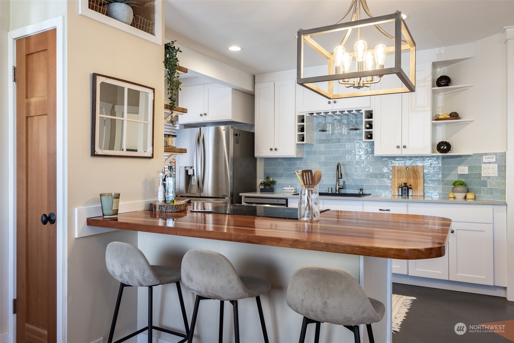 343 North 81st Street Seattle, WA 98103 - Photo 8 of 38 a kitchen with stainless steel appliances a sink and cabinets