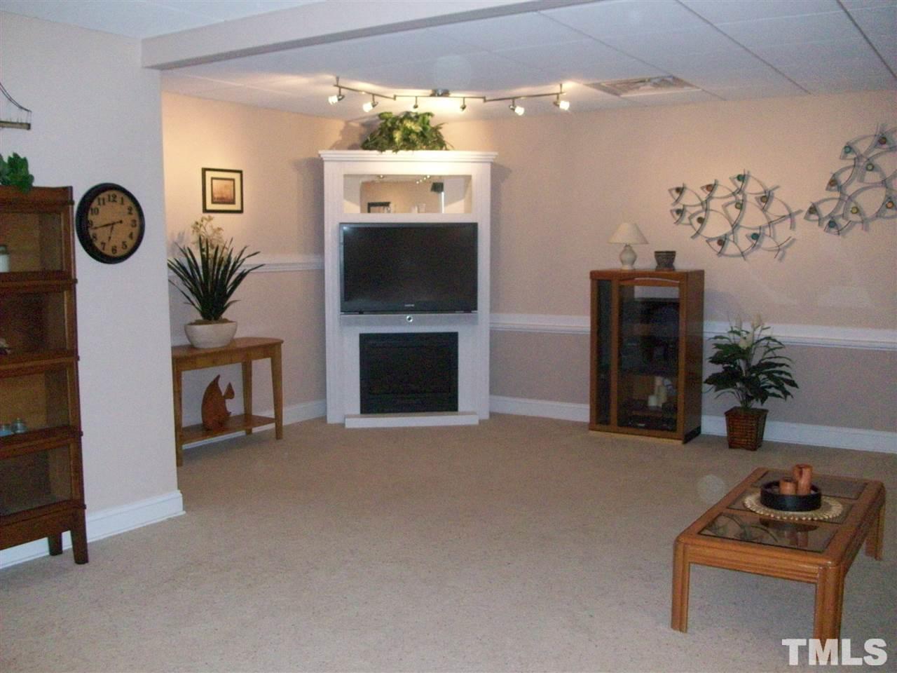 344 Steve Ridge Willow Spring, NC 27592 - Photo 13 of 18 a living room with furniture and a fireplace