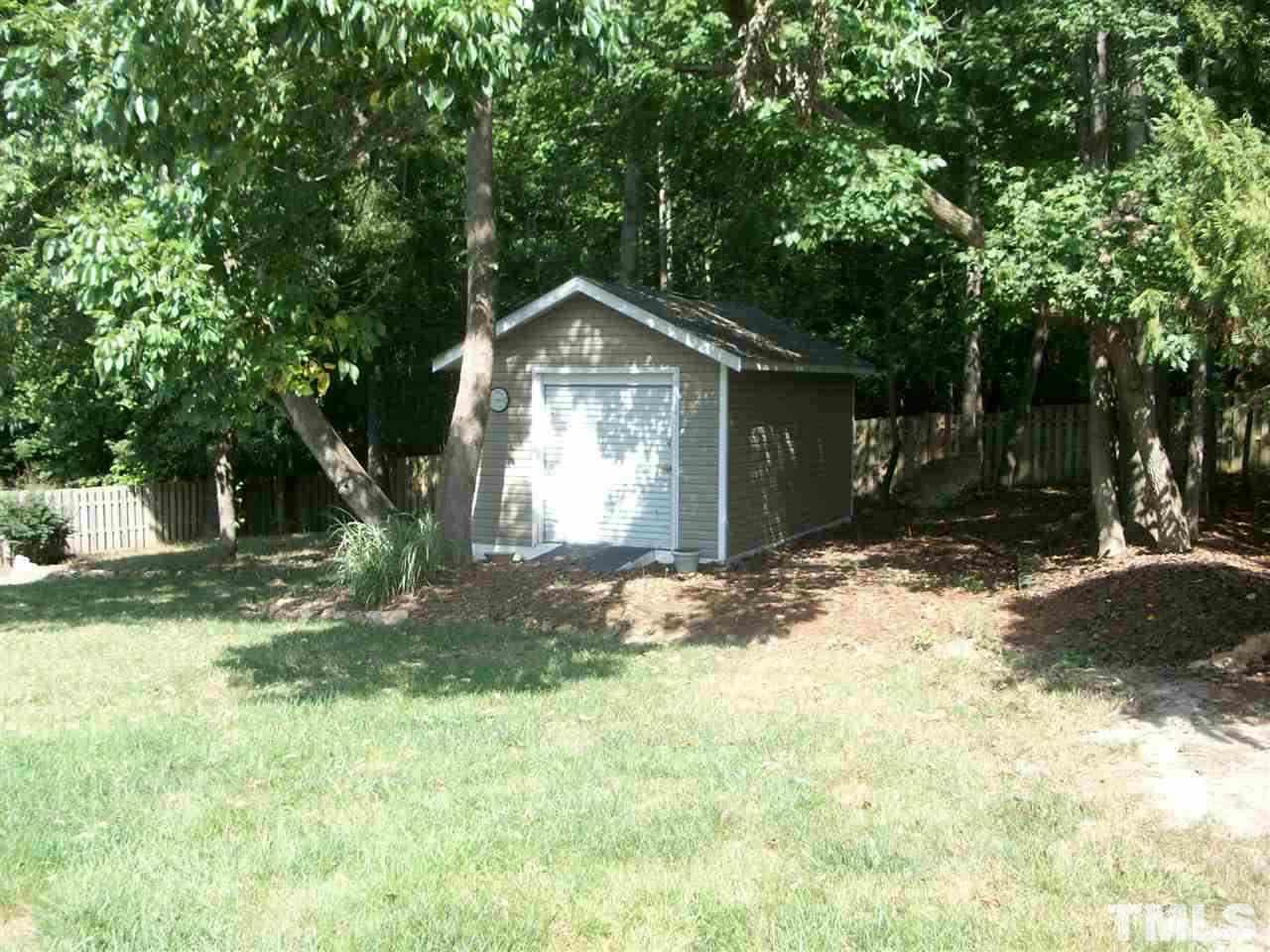 344 Steve Ridge Willow Spring, NC 27592 - Photo 16 of 18 a front view of a house with a yard and trees