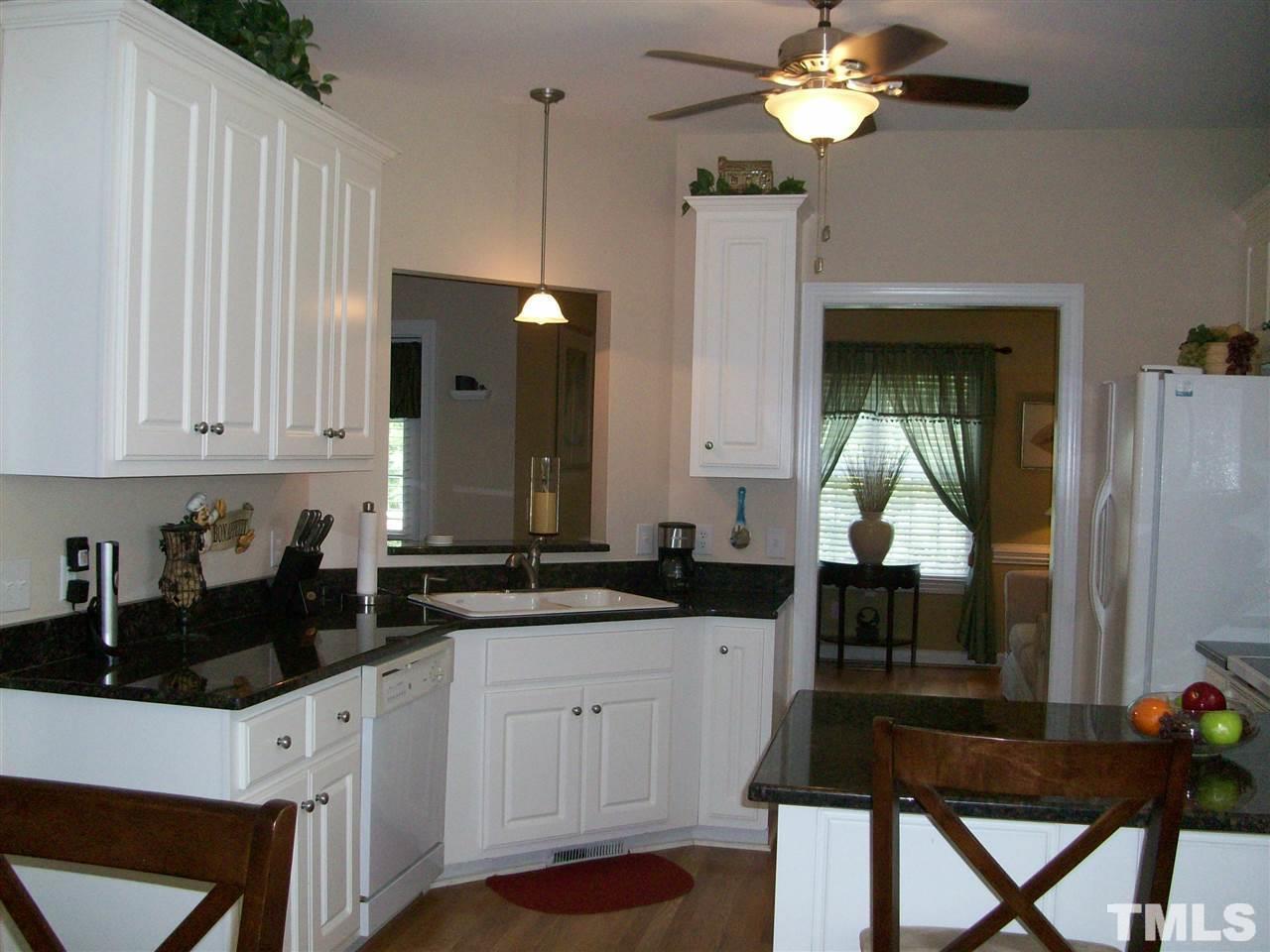 344 Steve Ridge Willow Spring, NC 27592 - Photo 3 of 18 a kitchen with a sink cabinets and window