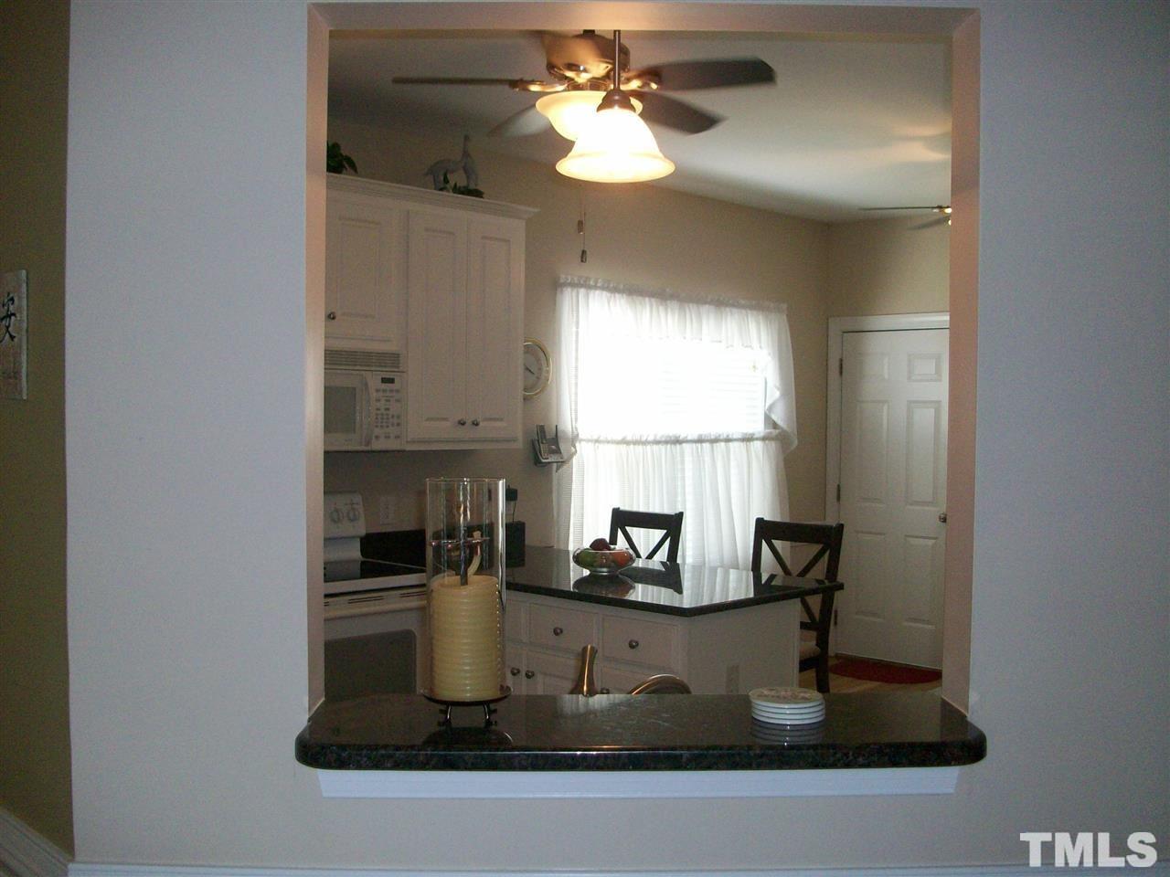 344 Steve Ridge Willow Spring, NC 27592 - Photo 4 of 18 a kitchen with a refrigerator and a sink