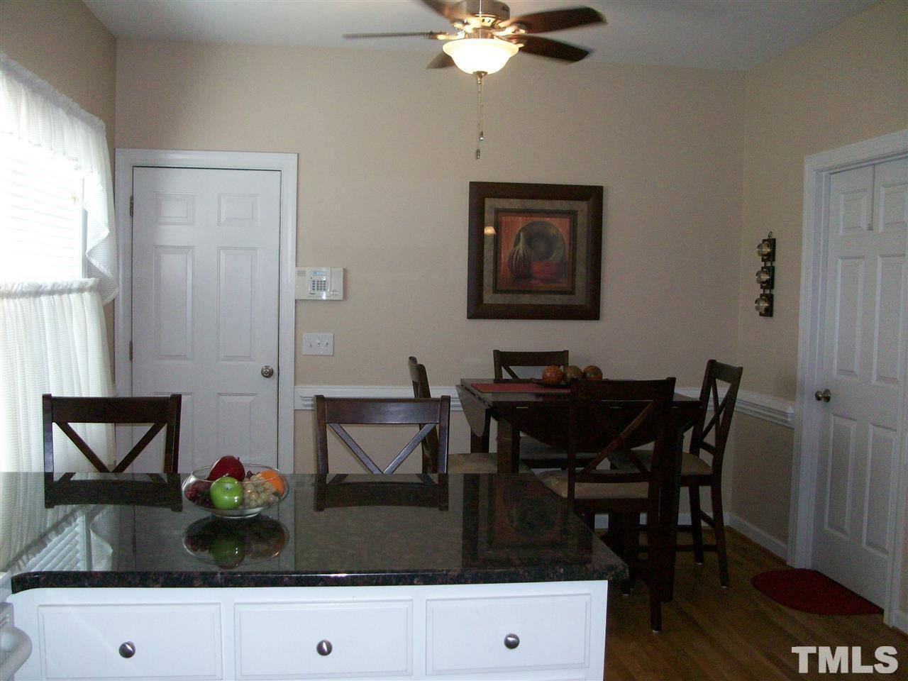344 Steve Ridge Willow Spring, NC 27592 - Photo 5 of 18 a view of a dining room with furniture and wooden floor