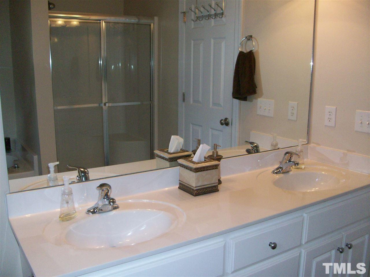 344 Steve Ridge Willow Spring, NC 27592 - Photo 8 of 18 a bathroom with a sink and a mirror