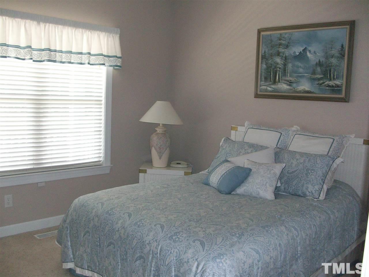 344 Steve Ridge Willow Spring, NC 27592 - Photo 9 of 18 a bedroom with a bed and a window