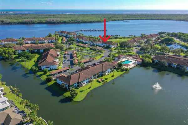 a front view of a house with a lake view