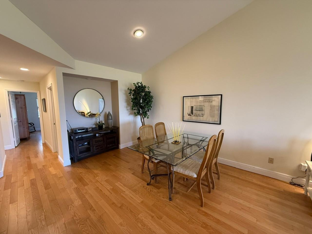 6102 Southeast Landing Way, Unit 13 Stuart, FL 34997 - Photo 4 of 14 a living room with furniture and a wooden floor